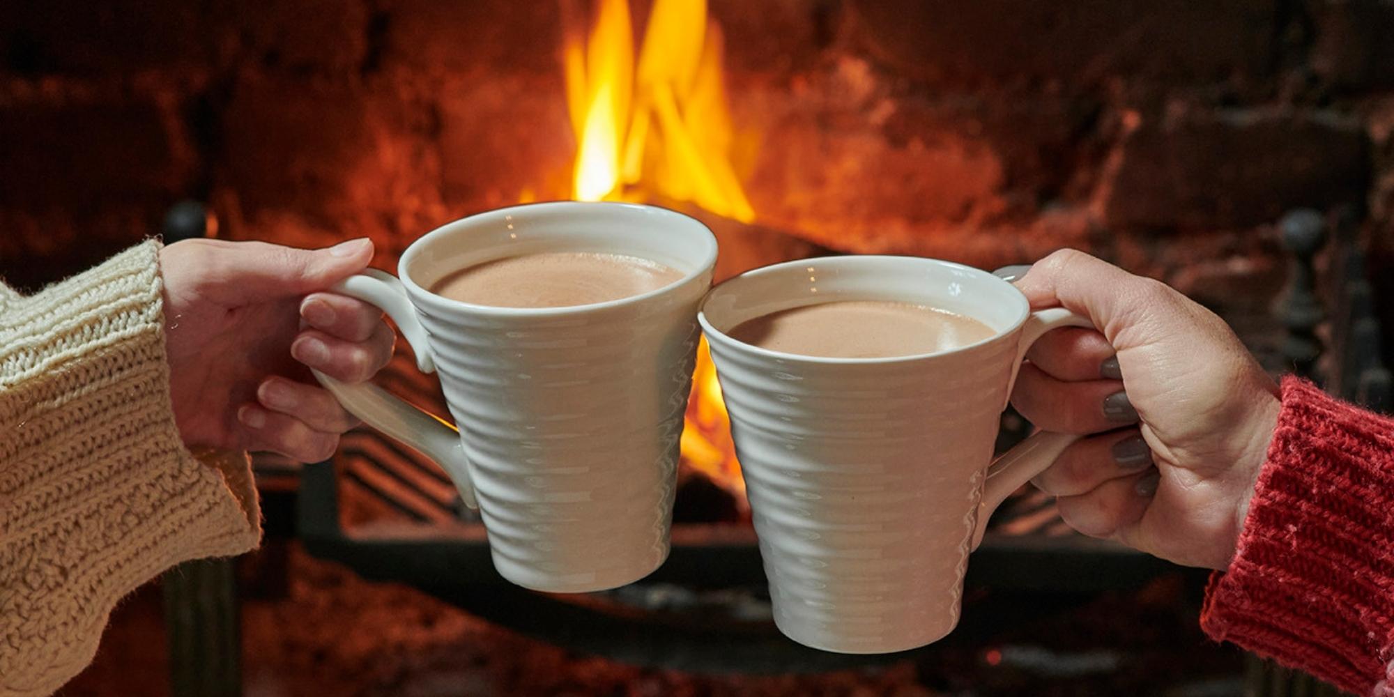 Hot chocolates by a fireplace