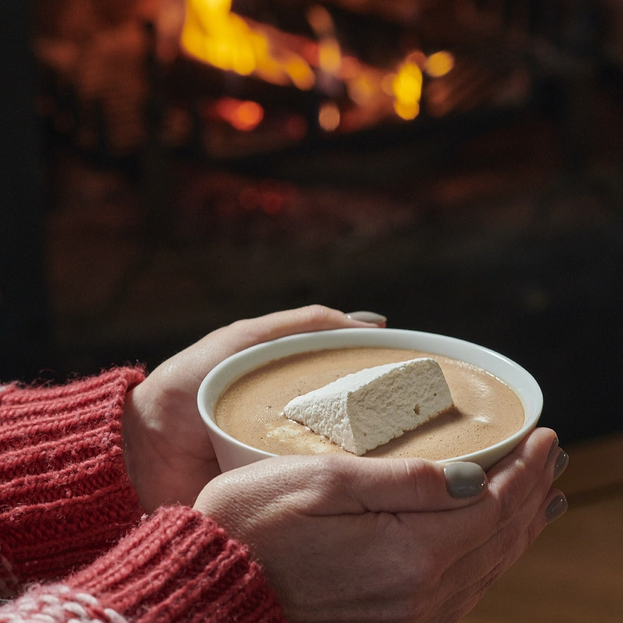 hot chocolate bowl in front of fire